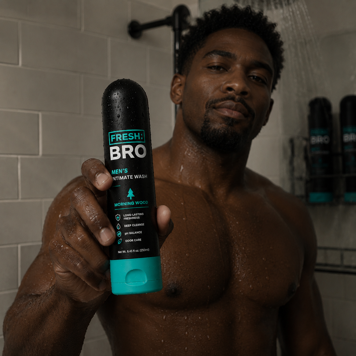 Man holding a 'Fresh Bro' men's intimate wash bottle in a bathroom.